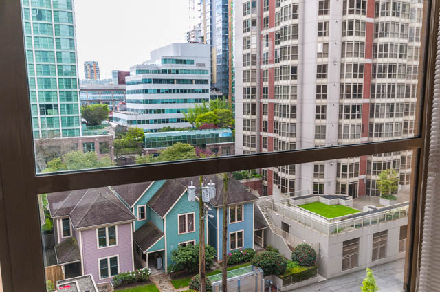 Furnished living room with city view and modern decor. - 505 - 822 Homer Street, Vancouver Downtown