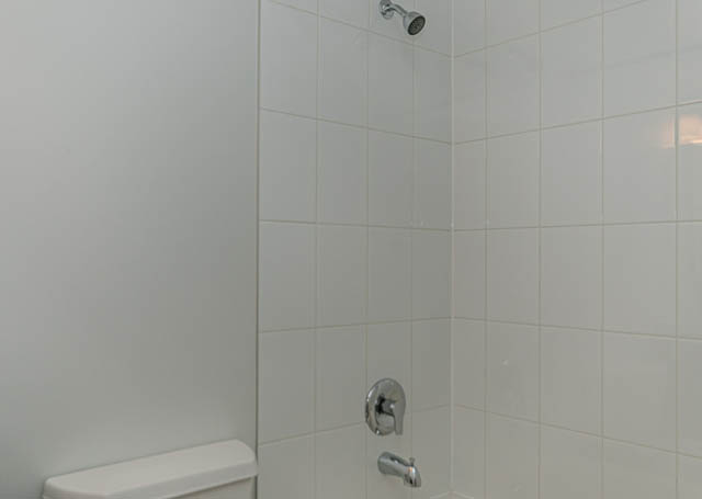 Bright bathroom with white tile and modern shower fixtures. - 505 - 822 Homer Street, Vancouver Downtown