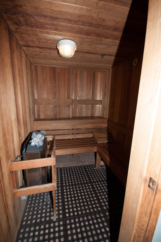Furnished sauna with wooden benches and checkered floor. - 505 - 822 Homer Street, Vancouver Downtown