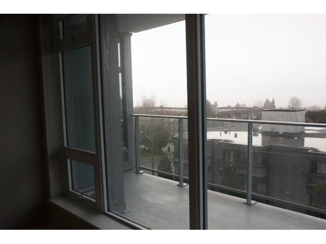 Balcony with city view and glass railings. - 407-150 West 15th Street, North Vancouver