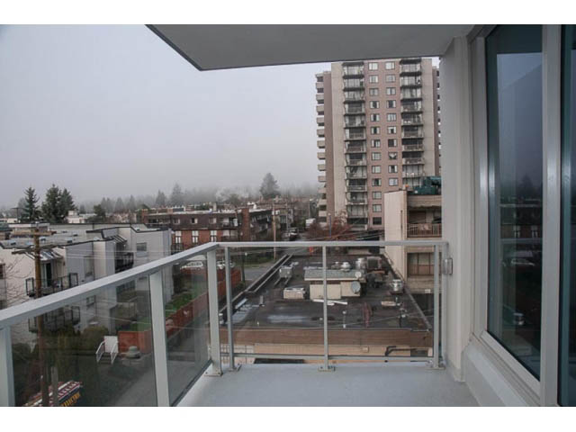 Furnished balcony with city view and modern railings. - 407-150 West 15th Street, North Vancouver
