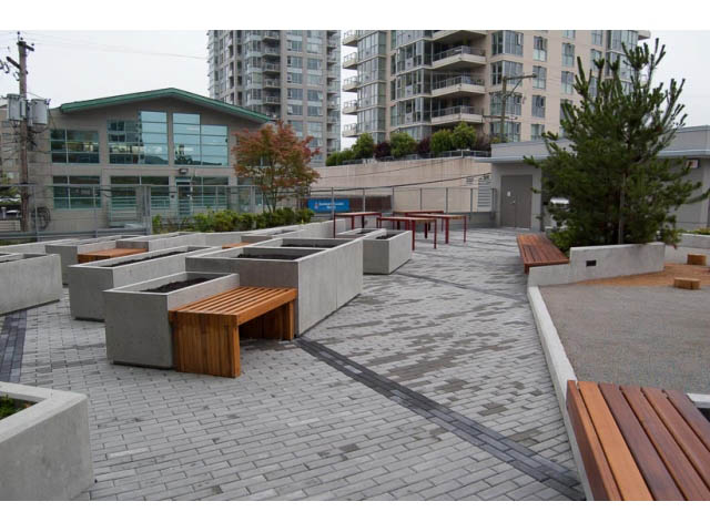 Furnished patio with modern seating and city views. - 407-150 West 15th Street, North Vancouver