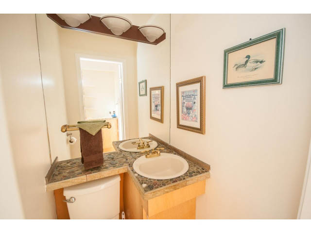 Bright bathroom with mosaic countertop and framed artwork. - 2720 Rosebery Avenue, West Vancouver