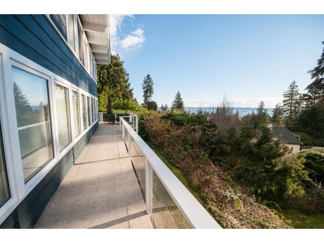 Furnished balcony with ocean view and lush greenery. - 2720 Rosebery Avenue, West Vancouver