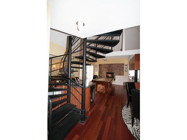 Furnished penthouse with open-concept layout, hardwood floors, and modern staircase. - 705 - 1263 Barclay, Vancouver Downtown