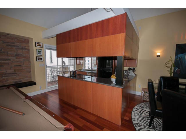 Bright kitchen with modern cabinetry, hardwood floors, and a city view. - 705 - 1263 Barclay, Vancouver Downtown