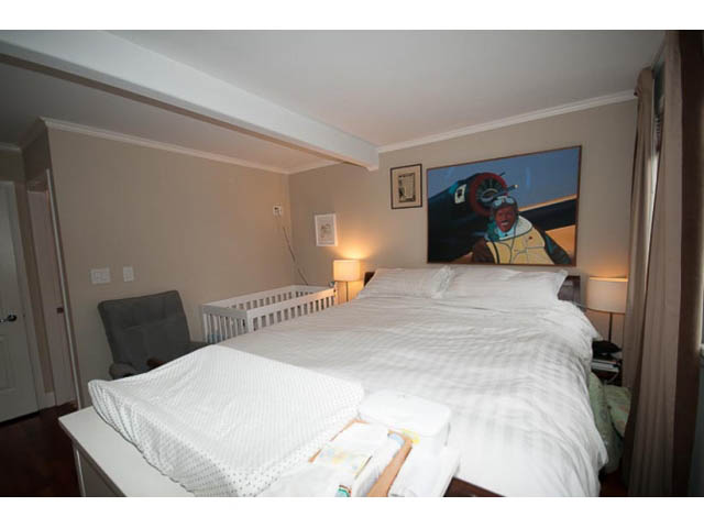 Furnished bedroom with neatly made beds, soft lighting, and a large painting on the wall. - 705 - 1263 Barclay, Vancouver Downtown