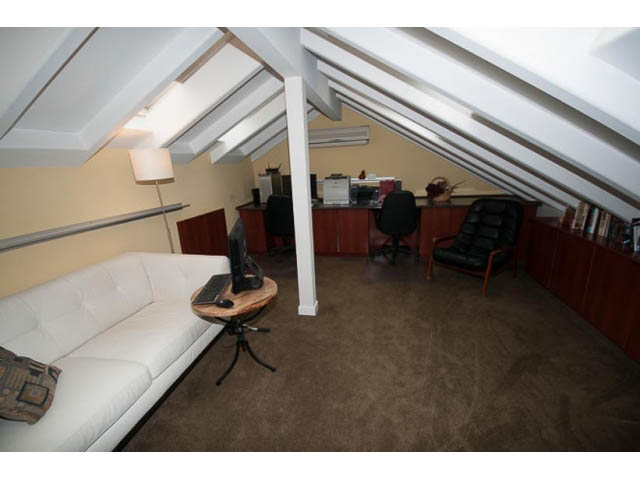 Furnished penthouse with wooden desk, white couch, and skylights. - 705 - 1263 Barclay, Vancouver Downtown