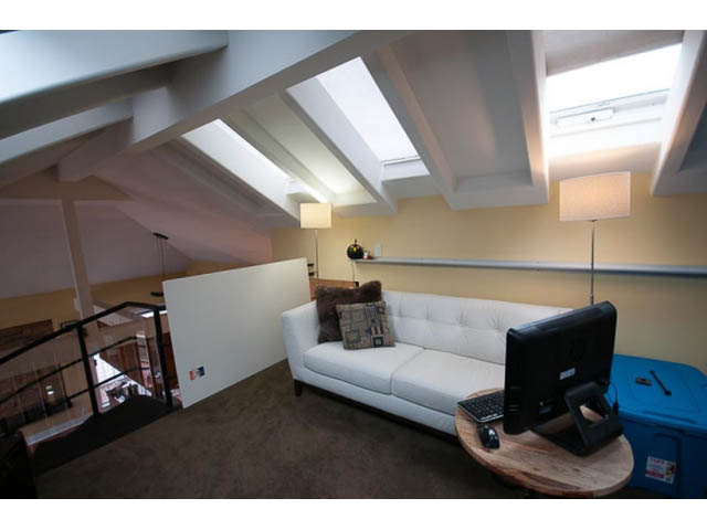 Furnished living room with white couch, skylights, and modern decor. - 705 - 1263 Barclay, Vancouver Downtown