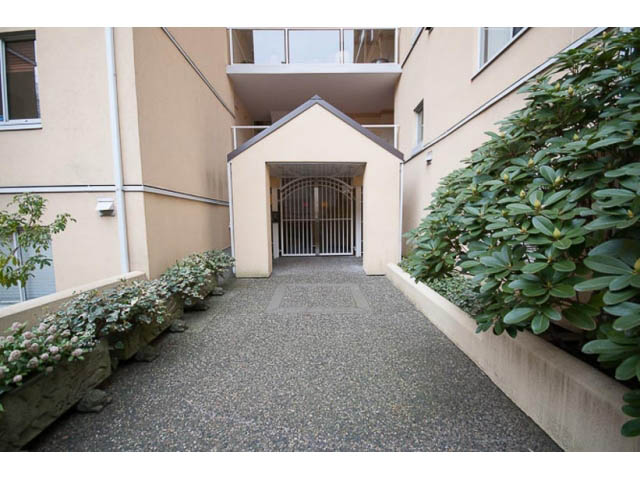 Furnished penthouse entrance with lush greenery and gravel path. - 705 - 1263 Barclay, Vancouver Downtown