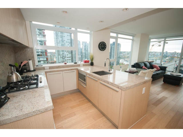 Bright kitchen with granite countertops, hardwood floors, and a stunning city view. - 1707 - 1351 Continental St, Vancouver Downtown