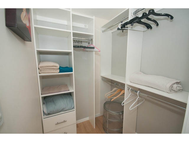 Furnished closet with shelves and hangers, neatly organized. - 1707 - 1351 Continental St, Vancouver Downtown
