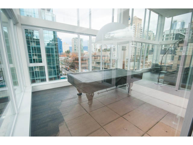 Furnished living room with hardwood floors and city view. - 1707 - 1351 Continental St, Vancouver Downtown