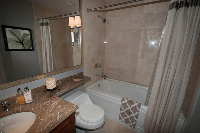 Furnished bathroom with marble countertops and a bathtub. - 2503 - 428 Beach Crescent, Vancouver Downtown