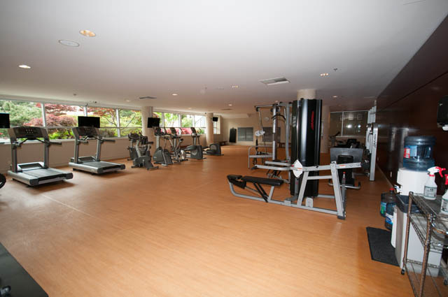 Bright and spacious fitness room with hardwood floors, treadmills, and weight machines. - 2503 - 428 Beach Crescent, Vancouver Downtown