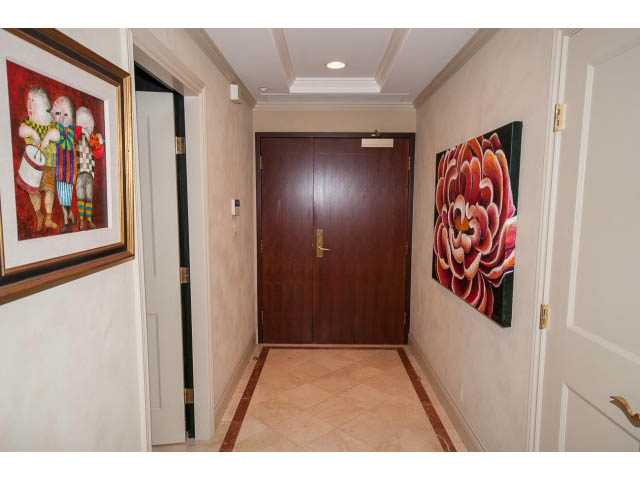 Furnished hallway with vibrant floral artwork and tiled flooring. - 1102 - 1777  Bayshore Drive, Vancouver Downtown