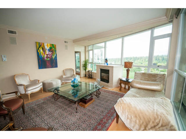 Furnished living room with hardwood floors, large windows, and a city view. - 1102 - 1777  Bayshore Drive, Vancouver Downtown