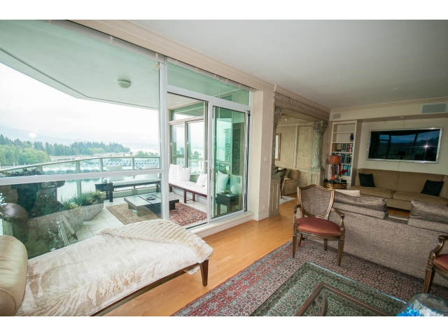 Spacious living room with hardwood floors, large windows, and a city view. - 1102 - 1777  Bayshore Drive, Vancouver Downtown
