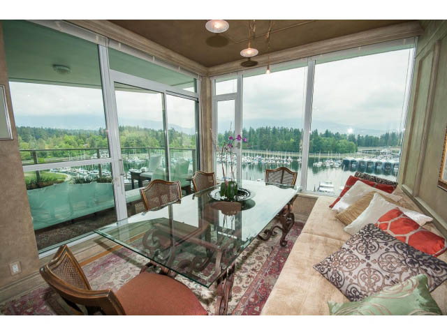 Bright living room with large windows, city view, and cozy furnishings. - 1102 - 1777  Bayshore Drive, Vancouver Downtown