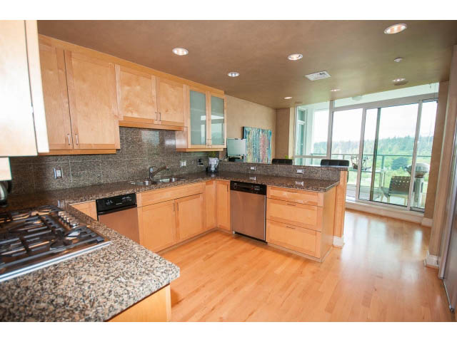 Bright kitchen with granite countertops, hardwood floors, and a city view. - 1102 - 1777  Bayshore Drive, Vancouver Downtown