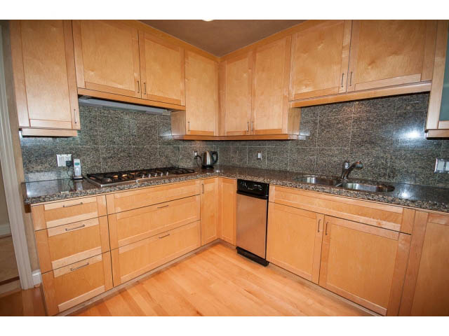 Bright kitchen with light wood cabinets, granite countertops, and hardwood floors. - 1102 - 1777  Bayshore Drive, Vancouver Downtown