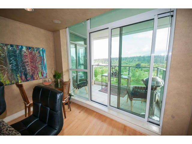 Bright living room with hardwood floors, city view, and sliding glass doors leading to a balcony. - 1102 - 1777  Bayshore Drive, Vancouver Downtown