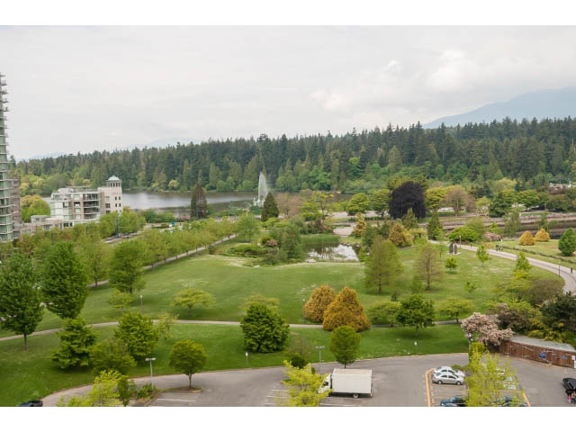 Bright living room with city view and lush greenery. - 1102 - 1777  Bayshore Drive, Vancouver Downtown