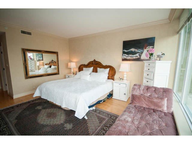 Furnished 2-bedroom + den with hardwood floors and a cozy bed setup. - 1102 - 1777  Bayshore Drive, Vancouver Downtown