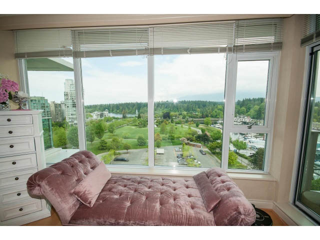 Bright living room with plush pink chaise lounge and stunning city view through large windows. - 1102 - 1777  Bayshore Drive, Vancouver Downtown