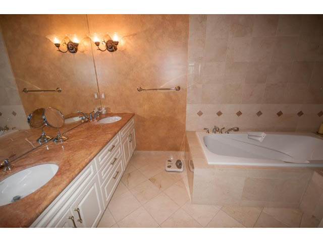 Furnished bathroom with marble countertops and a large mirror. - 1102 - 1777  Bayshore Drive, Vancouver Downtown