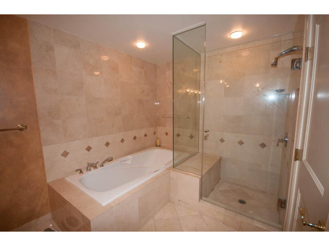 Furnished bathroom with a large bathtub and glass shower enclosure. - 1102 - 1777  Bayshore Drive, Vancouver Downtown