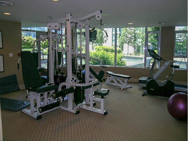 Bright fitness room with exercise equipment and city view. - 1102 - 1777  Bayshore Drive, Vancouver Downtown