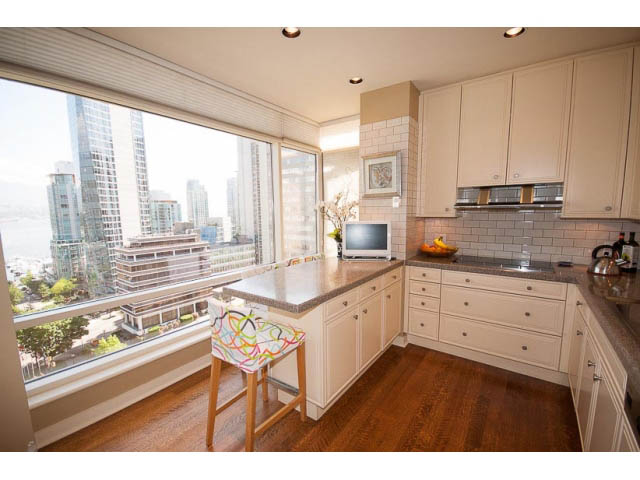 Bright kitchen with hardwood floors, city view, and granite countertops. - 9A - 1500 Alberni St, Vancouver Downtown