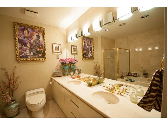 Bright bathroom with beige countertops and gold accents. - 9A - 1500 Alberni St, Vancouver Downtown