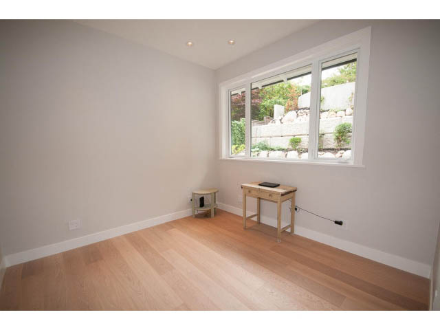 Spacious den with hardwood floors and large windows overlooking a garden. - 905 Braeside St, West Vancouver