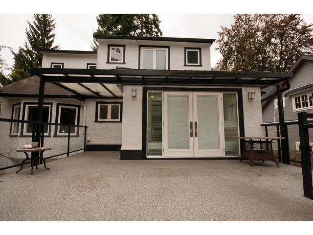 Shared living area with modern furnishings and large windows. - 3407 West 34th Ave, Vancouver West Side