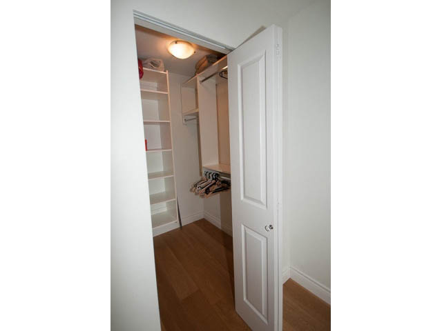 Bright walk-in closet with wooden floors and shelves. - 409 - 3023 West 4th Ave., Vancouver West Side