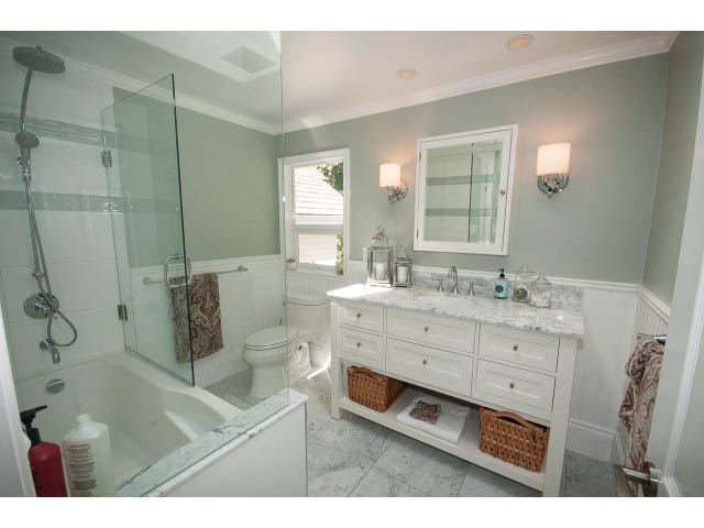 Furnished bathroom with marble countertops and a glass-enclosed shower. - 3364 Redfern Pl., North Vancouver