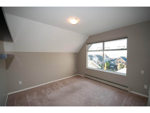 Spacious living room with large windows and city view. - 3 - 260 East 4th St, North Vancouver