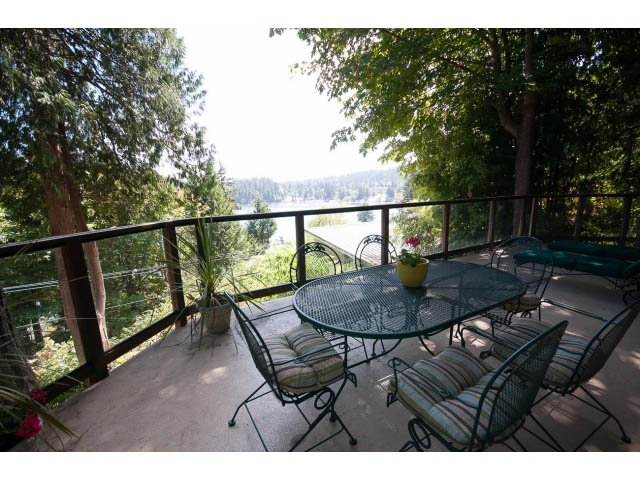 Furnished patio with outdoor furniture and a scenic view of the lake. - 2795 Panorama Drive, North Vancouver