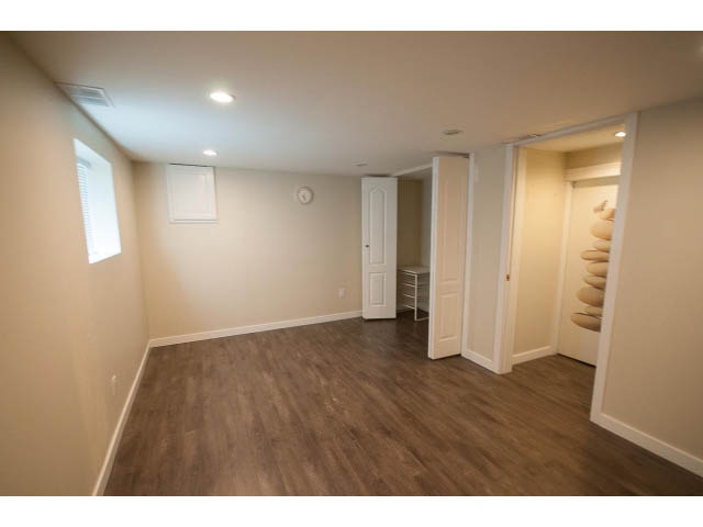 Furnished den with hardwood floors and white cabinetry. - 3939 West 11th Ave, Vancouver West Side
