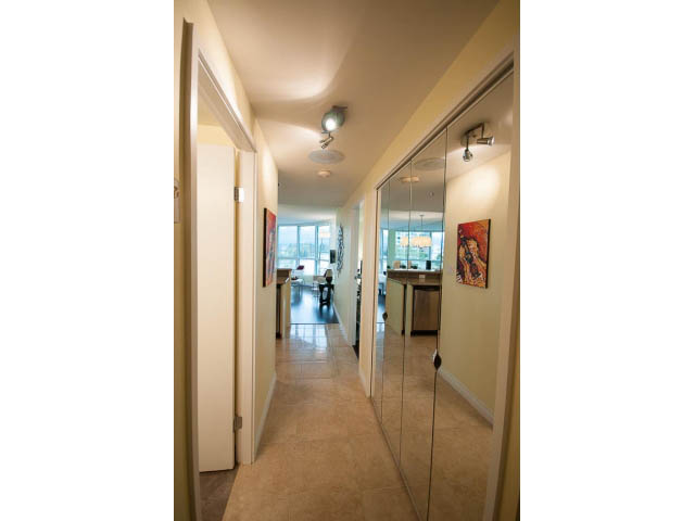 Furnished hallway with mirrored closet doors and light wood flooring. - 502 - 555 Jervis, Vancouver Downtown