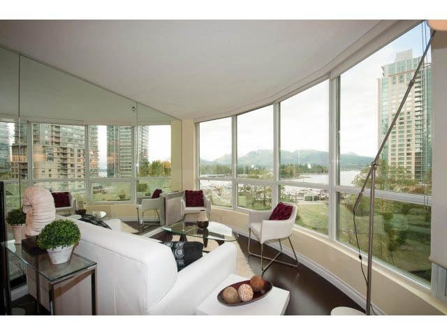Bright living room with large windows, city view, and modern furnishings. - 502 - 555 Jervis, Vancouver Downtown