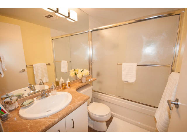Furnished bathroom with marble countertops and a sliding glass shower. - 502 - 555 Jervis, Vancouver Downtown