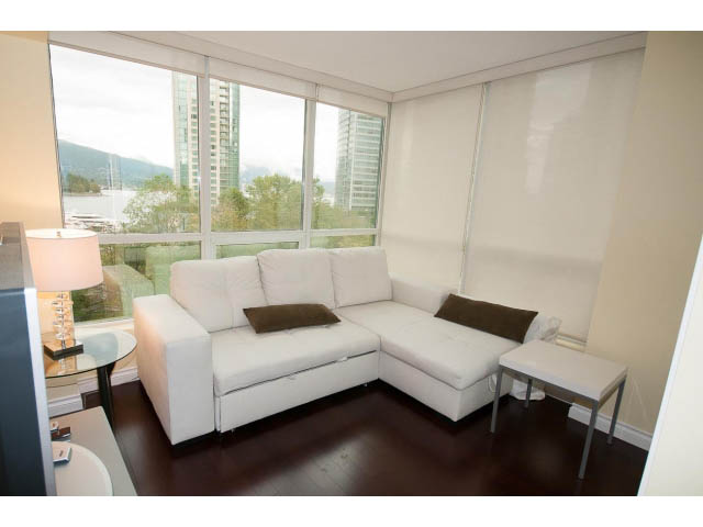 Furnished living room with city view and hardwood floors. - 502 - 555 Jervis, Vancouver Downtown