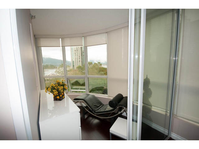 Furnished living room with hardwood floors and city view. - 502 - 555 Jervis, Vancouver Downtown