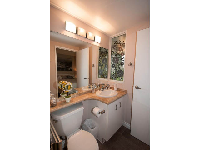 Furnished bathroom with wooden countertops and a modern sink. - 502 - 555 Jervis, Vancouver Downtown