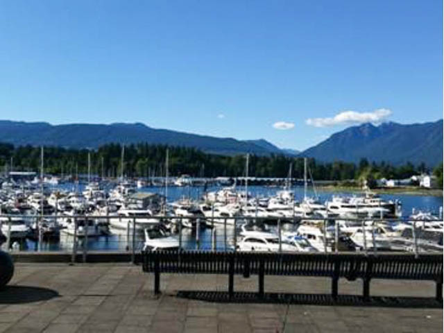 Bright balcony with stunning city view and marina, overlooking boats and mountains. - 502 - 555 Jervis, Vancouver Downtown