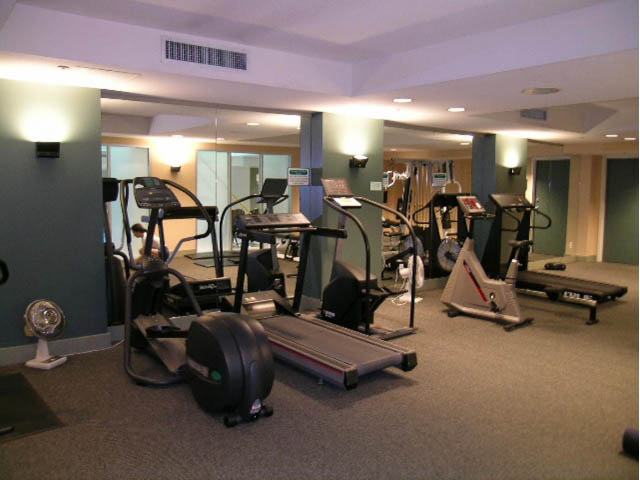 Bright gym with cardio machines and mirrors. - 502 - 555 Jervis, Vancouver Downtown