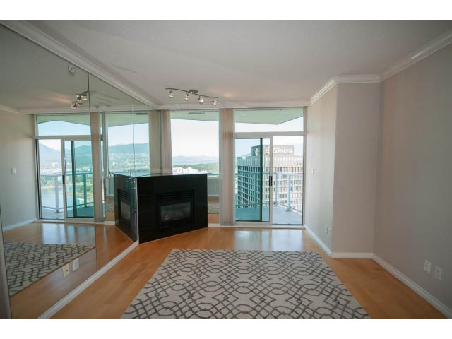 Spacious living room with hardwood floors, city view, and modern decor. - 3405-1111 W Pender, Vancouver Downtown